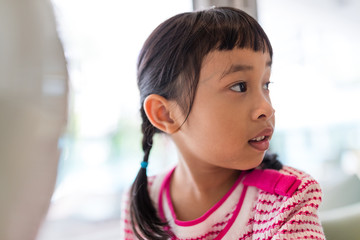 Adorable girl looking side