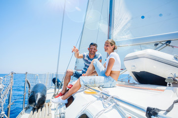 Father with adorable kids resting on yacht