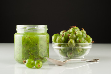Gooseberry smoothie in a jar on a white table