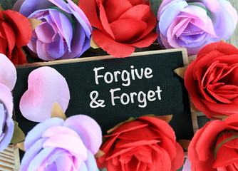 concept of forgive and forget on chalkboard