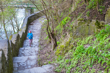 The woman running the stairs in the Park.