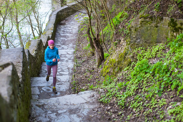 The woman running the stairs in the Park.