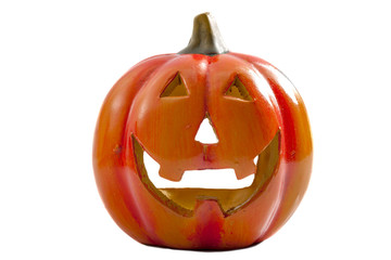 Halloween and fall holidays concept with a smiling jack o’lantern carved from a pumpkin isolated on white with clipping path