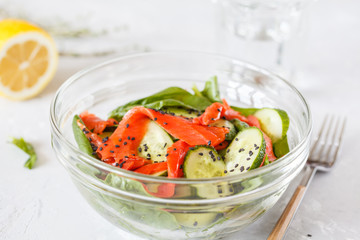 Green salad with spinach, vegetables and salted salmon