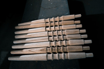 Wooden fragment ornament for shisha decoration on a wooden background.