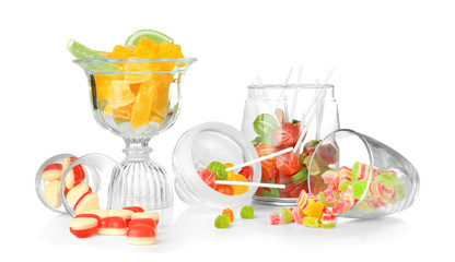 Colorful candies in glassware on white background