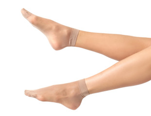 Legs of beautiful young woman in socks on white background