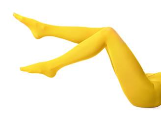 Legs of beautiful young woman in tights on white background