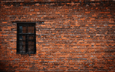 Old black brick wall and window locked with metal bars - Powered by Adobe