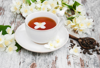 Cup of tea with jasmine flowers