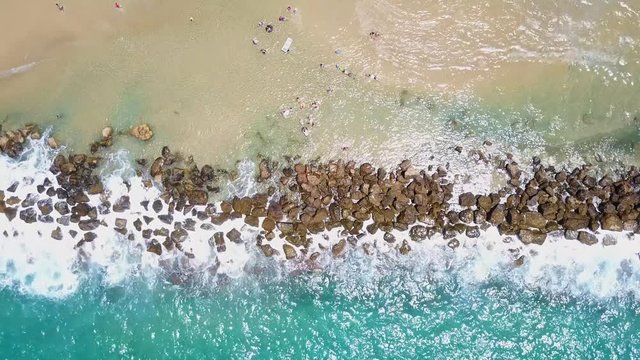 Tropical beach and wave breaker - Aerial shot