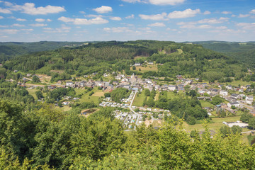 Fototapeta na wymiar Bird's eye view of Poupehan, seen from the pulpit lookout. The village is in a typical Ardennes setting.