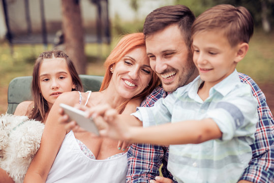Family taking picture of themselves
