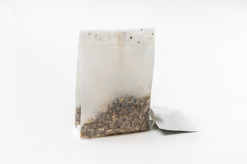 One tea bag isolated on white