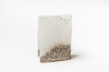 One tea bag isolated on white