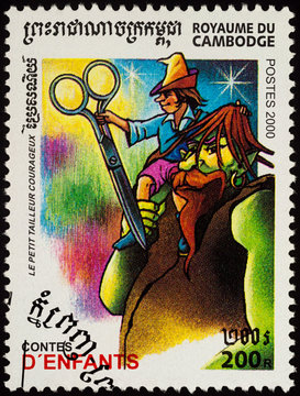 Scene from a fairy tale "The brave little tailor" (Brothers Grimm) on postage stamp