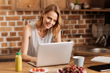 Joyful brilliant woman enjoying her free working schedule