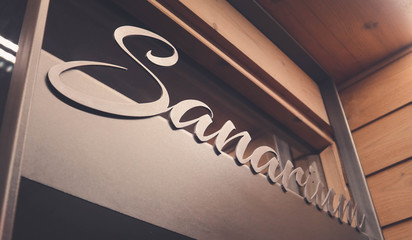 sanarium sauna volumetric lettering decoration inscription at the spa hotel. Entrance sign sanarium type at the wellness center, closeup.