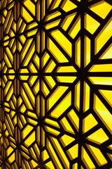 Abstract stained-glass window at the spa center. Floral pattern mosaic glass.