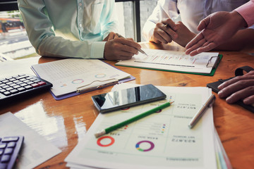 Administrator business man financial inspector and secretary making report, calculating or checking balance.