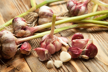 Fresh garlic on old wooden background
