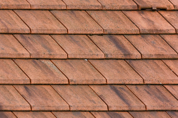 Background of orange color. Roof tiles.