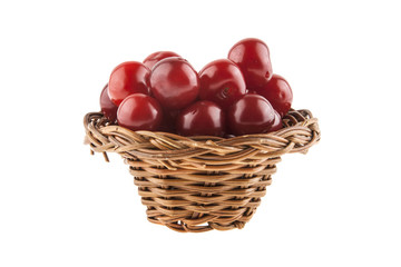 Cherries in a wicker basket isolated on a white background