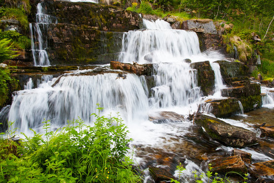 waterfall Tvindefossen in summer, Norway