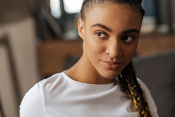 Close up of kind girl that looking aside