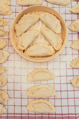 Many Dumpling on a Kitchen Towel.