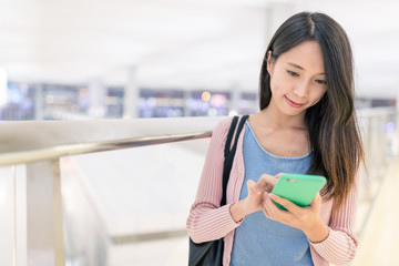 Woman use of cellphone in airport