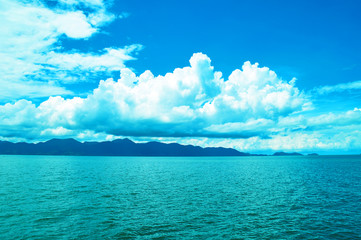 Sea and blue sky with clouds background
