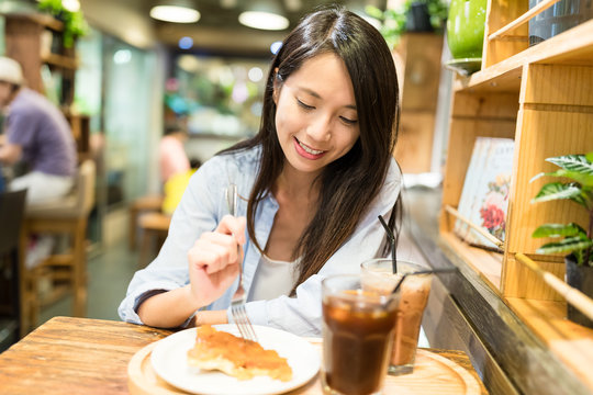 Young Woman Enjoy Her Food In Restaurant