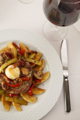 Pork and grilled vegetables arranged on a plate, Traditional dish in elegant setting, Selective focus with soft light