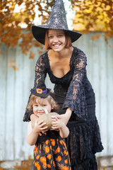 Mother and child dressed like witches