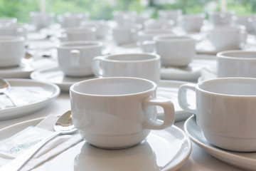 White cup of coffee for Customer service in hotell.