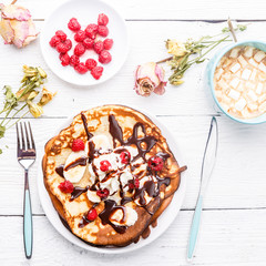 Breakfast with pancakes filled chocolate