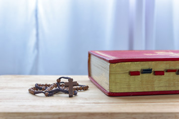 Catholic rosary beads and bible