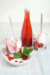 Ice cream with strawberry sauce.