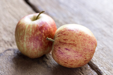 Fresh apples on wooden table.