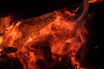 Background of orange and red sparks from a campfire at night