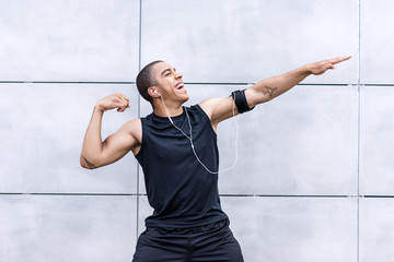 african american runner stretching on street