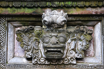 Closeup of traditional Balinese God statue in Bali temple