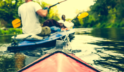 nose of canoe floating behind rower on a river © Ievgen Skrypko