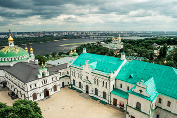 Fototapeta na wymiar view of yard in Kyiv Pechersk Lavra and Kyiv cityscape from bell tower
