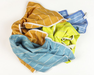 old colorful rags on white background - top view