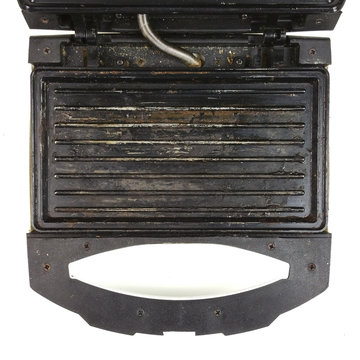 old broken eletric sandwich toaster - top view