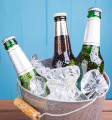 Beer bottles inside ice bucket