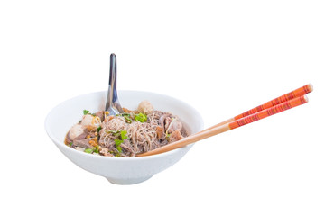noodle meat ball and pig piece in bowl on table with broth intense. top view isolated  white background and clipping path