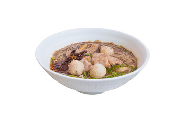 noodle meat ball and pig piece in bowl on table with broth intense. top view isolated oover  white background and clipping path
